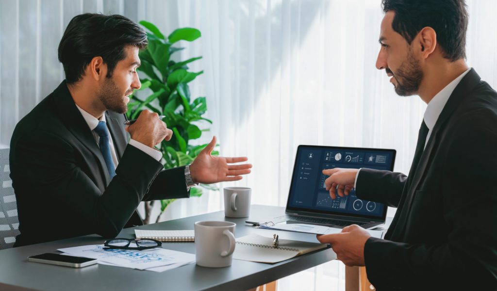 two-men-are-discussing-project-that-has-time-9-30 Consulting
